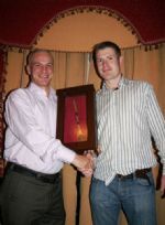 Willie Darragh takes ownership of the Wooden Spoon from Peter O'Neill