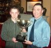 Joey O'Neill presents a trophy to Jonathan Hurl